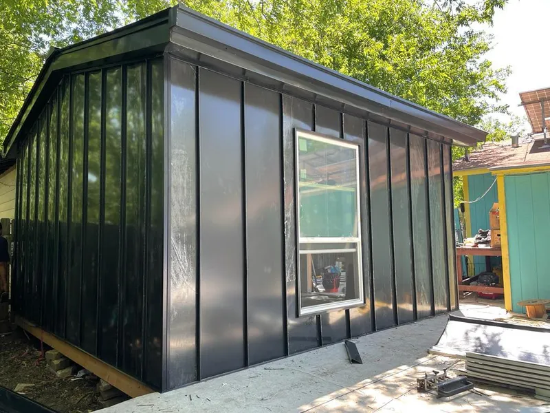 Black standing seam metal wall panels for Metal Roof Installation in Madison